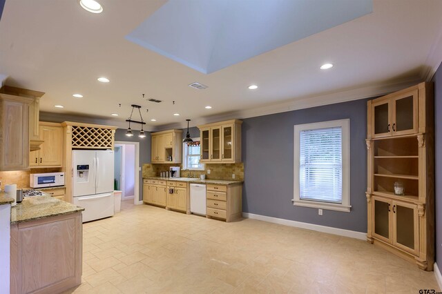 kitchen featuring light stone counters, ornamental molding, tasteful backsplash, white appliances, and pendant lighting