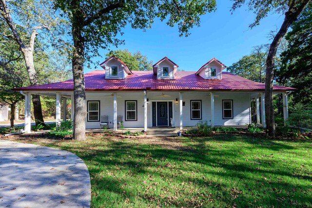 view of front of home with a porch and a front lawn