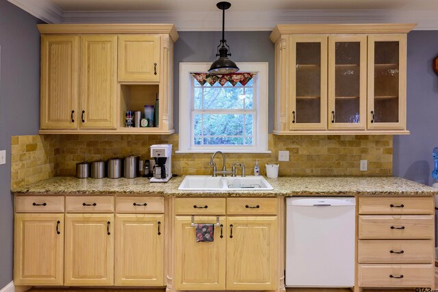 kitchen featuring crown molding, decorative backsplash, sink, and white dishwasher