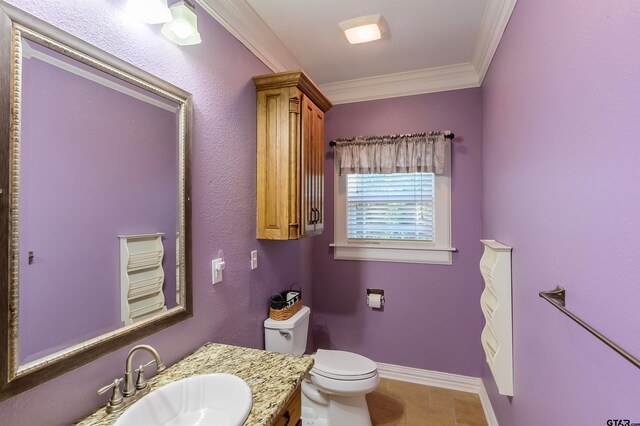 bathroom featuring vanity, tile patterned floors, toilet, and crown molding