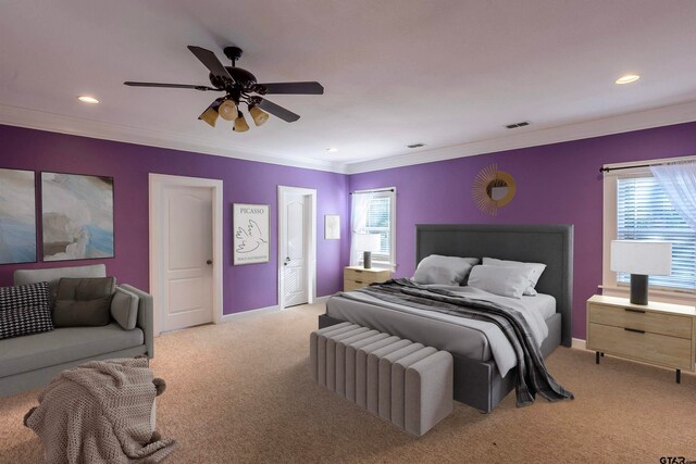 carpeted bedroom featuring ornamental molding, multiple windows, and ceiling fan