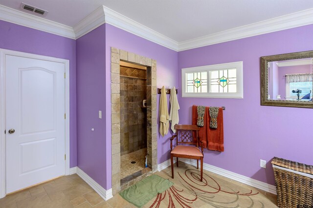 sitting room featuring ornamental molding and a healthy amount of sunlight