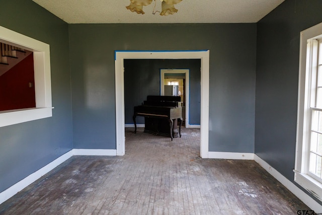 empty room with dark hardwood / wood-style floors