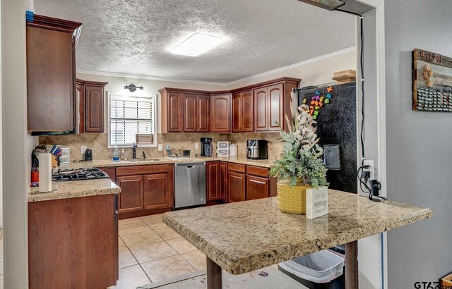 260 County Road 2302, Rusk, TX 75785 - kitchen featuring dishwasher, a peninsula, light countertops, crown molding, and decorative backsplash