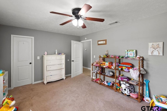260 County Road 2302, Rusk, TX 75785 - recreation room featuring ceiling fan, a textured ceiling, carpet, and baseboards