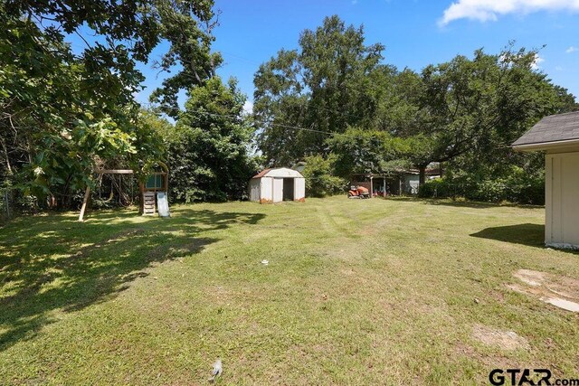 260 County Road 2302, Rusk, TX 75785 - view of grassy yard with a playground