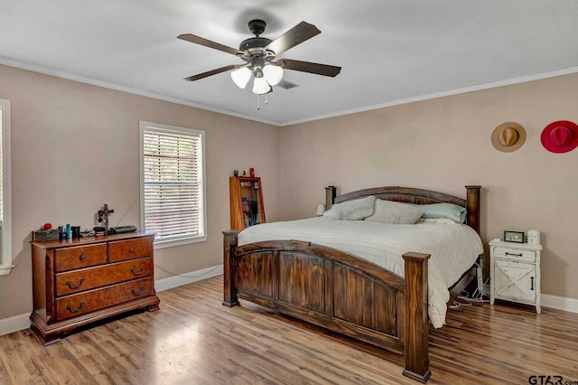 260 County Road 2302, Rusk, TX 75785 - bedroom featuring wood finished floors, baseboards, crown molding, and ceiling fan