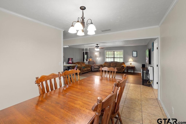 260 County Road 2302, Rusk, TX 75785 - dining space featuring a chandelier, light tile patterned floors, ornamental molding, baseboards, and ceiling fan