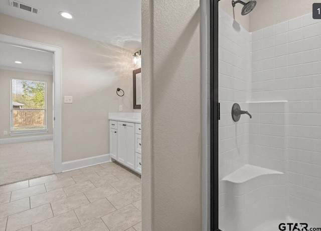bathroom featuring visible vents, baseboards, recessed lighting, vanity, and a stall shower