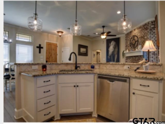 kitchen featuring crown molding, ceiling fan, white cabinets, dishwasher, and a sink
