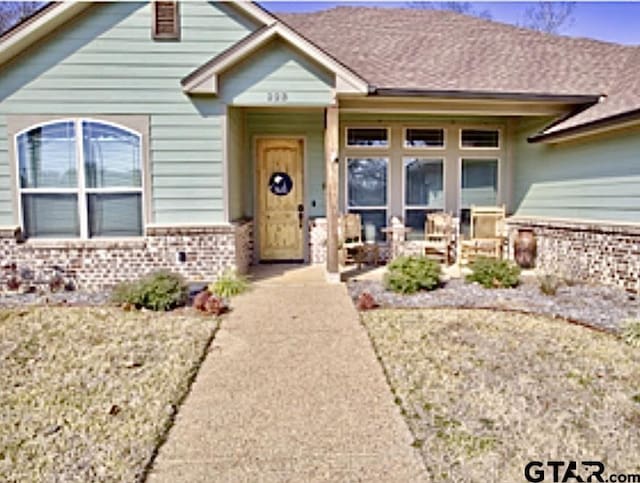 view of front of house with brick siding