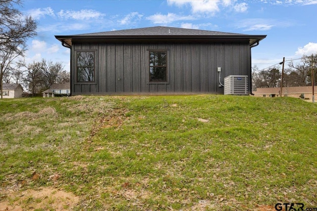 view of home's exterior featuring a lawn and cooling unit