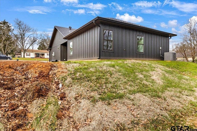 view of property exterior featuring a yard and central air condition unit