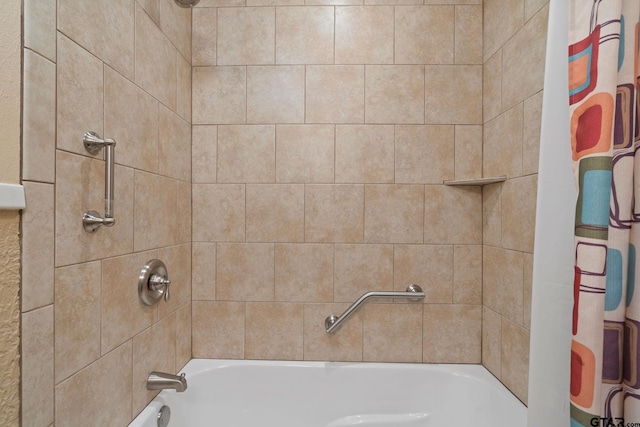 bathroom with shower / bath combo with shower curtain