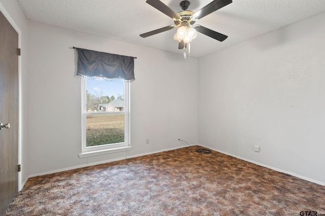 carpeted empty room with a textured ceiling and ceiling fan