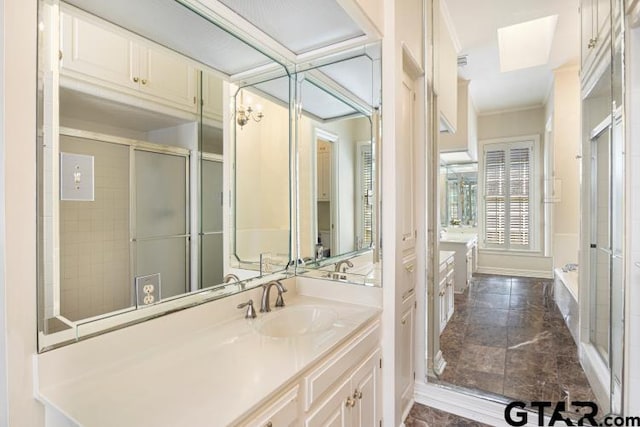 full bathroom with ornamental molding, a stall shower, a bathtub, and vanity