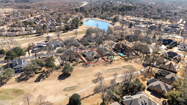 birds eye view of property featuring a water view and a residential view