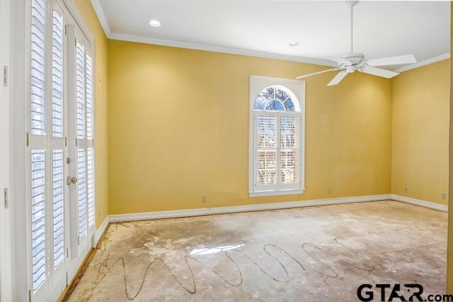 unfurnished room featuring plenty of natural light, ornamental molding, and baseboards