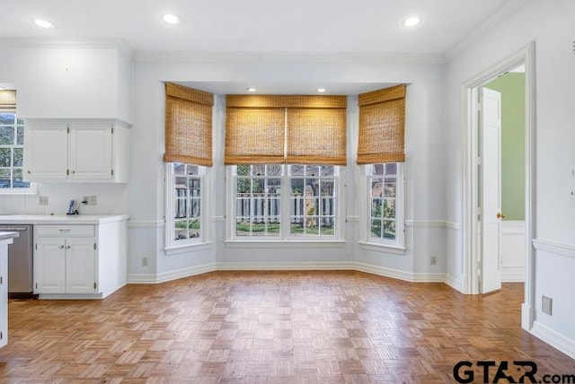 unfurnished dining area with ornamental molding, recessed lighting, and baseboards