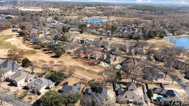 bird's eye view with a residential view and a water view