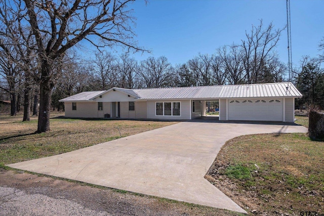 110 Vz County Road 2121, Canton, TX 75103 - ranch-style house featuring metal roof, concrete driveway, a front lawn, and an attached garage