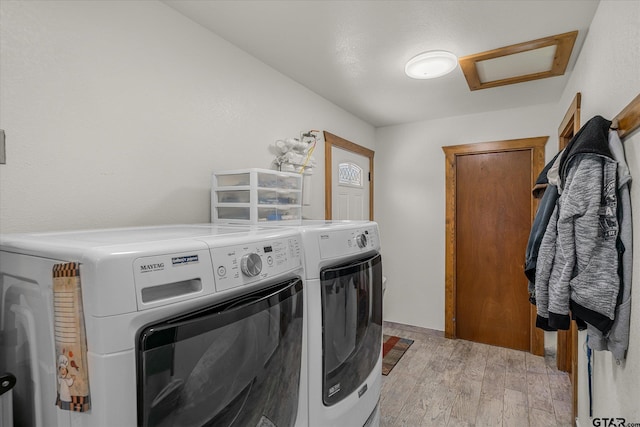 110 Vz County Road 2121, Canton, TX 75103 - laundry room with laundry area, attic access, baseboards, washing machine and clothes dryer, and light wood-style floors