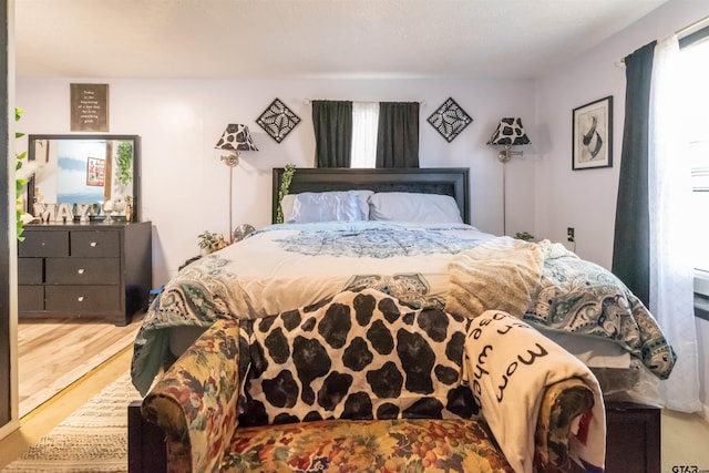 bedroom featuring wood finished floors