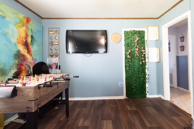 interior space featuring dark wood finished floors, baseboards, ornamental molding, and visible vents