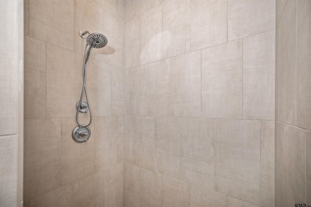 details with a tile shower