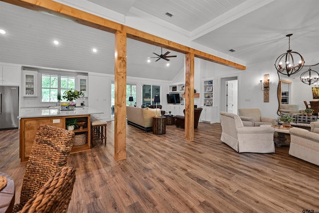 living area featuring recessed lighting, dark wood-style floors, vaulted ceiling with beams, and ceiling fan with notable chandelier