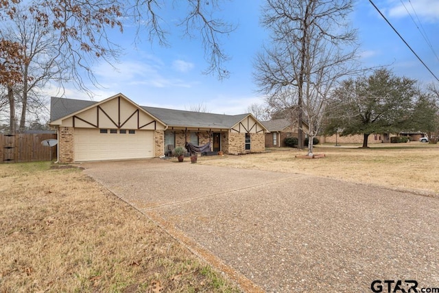 810 Corey Dr, Whitehouse, TX 75791 - tudor-style house featuring driveway, a garage, and brick siding