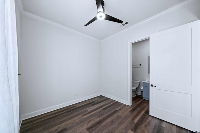 unfurnished bedroom with crown molding, ensuite bath, ceiling fan, and dark hardwood / wood-style floors