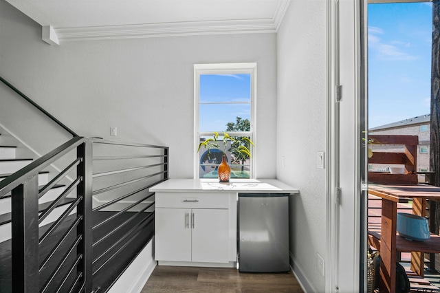 interior space featuring stainless steel refrigerator, hardwood / wood-style flooring, and crown molding