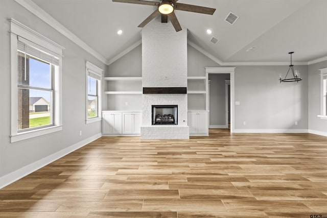 16219 Tulare, Lindale, TX 75771 - unfurnished living room with visible vents, crown molding, a fireplace, and light wood-type flooring