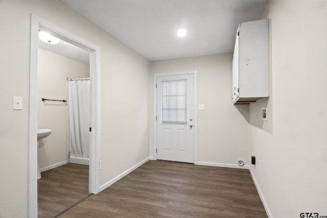 laundry area with dark wood-type flooring and washer hookup