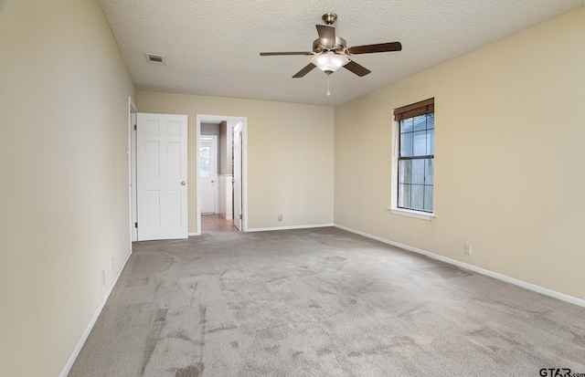 17617 Carol Cir, Flint, TX 75762 - unfurnished bedroom featuring carpet flooring, baseboards, a textured ceiling, and a ceiling fan