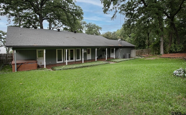 17617 Carol Cir, Flint, TX 75762 - back of property featuring a hot tub and a shingled roof