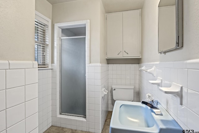 bathroom featuring sink, tile walls, an enclosed shower, and toilet