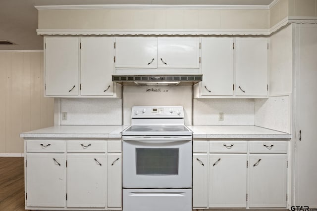 kitchen with extractor fan, white cabinets, dark hardwood / wood-style flooring, and electric stove