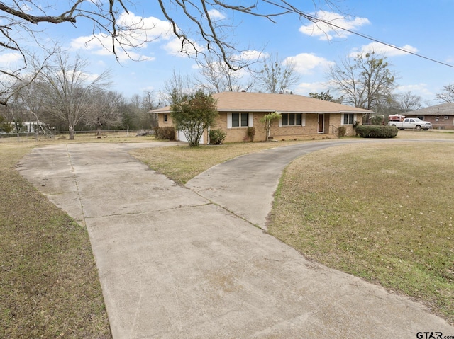 ranch-style home with a front yard