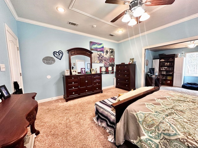 carpeted bedroom featuring ceiling fan and crown molding