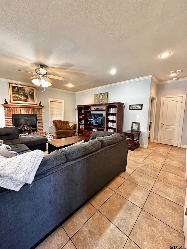 living room with light tile patterned floors, a textured ceiling, ceiling fan, and ornamental molding