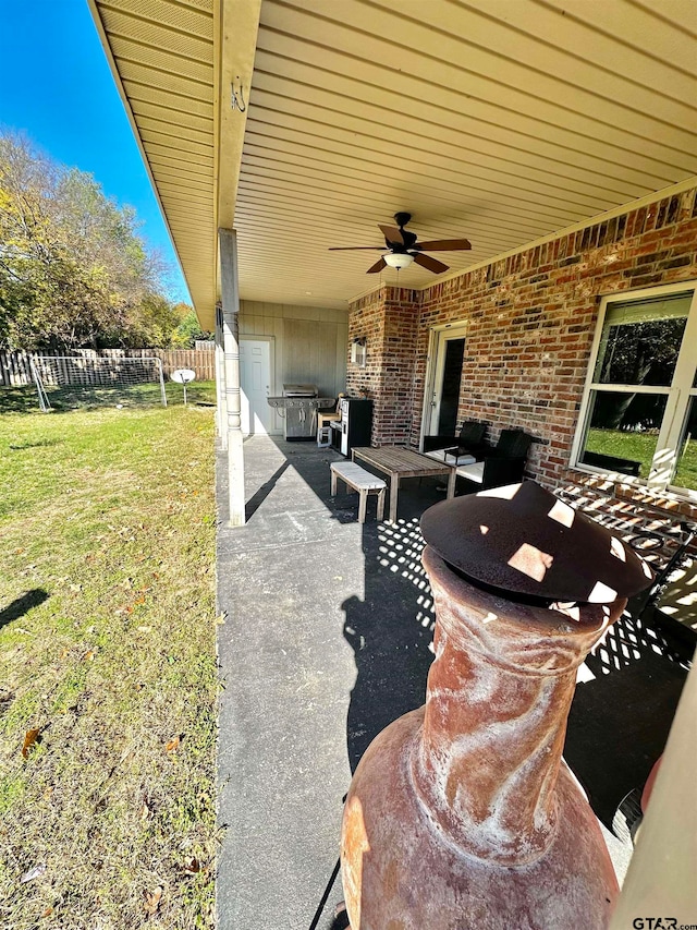 view of patio featuring ceiling fan