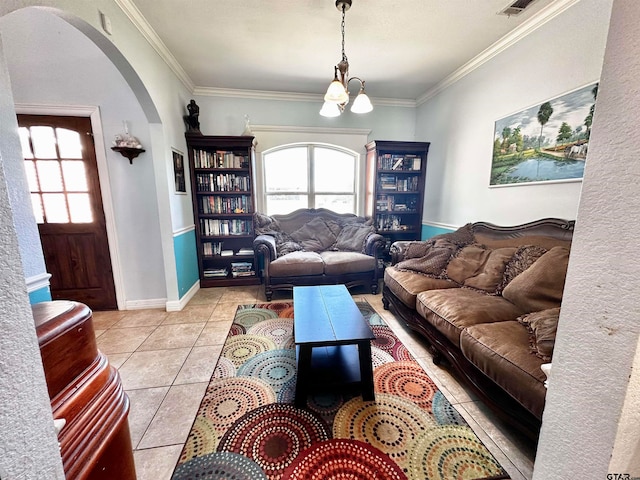 tiled living room with a notable chandelier and crown molding