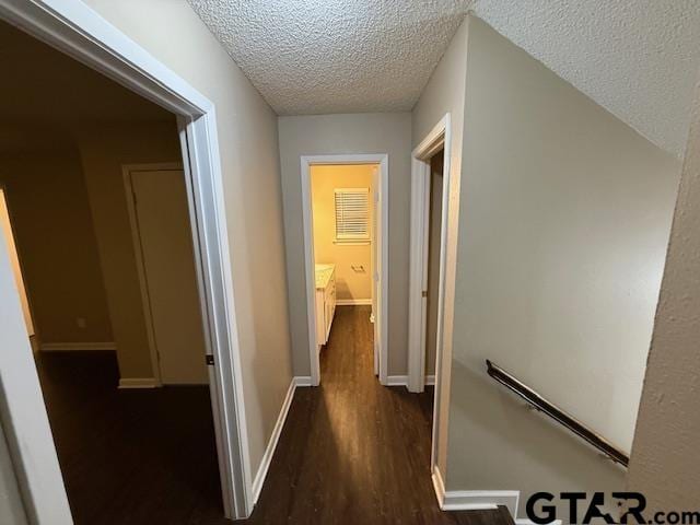 2523 Westminster Dr, Tyler, TX 75701 - hall featuring dark wood-style flooring and a textured ceiling