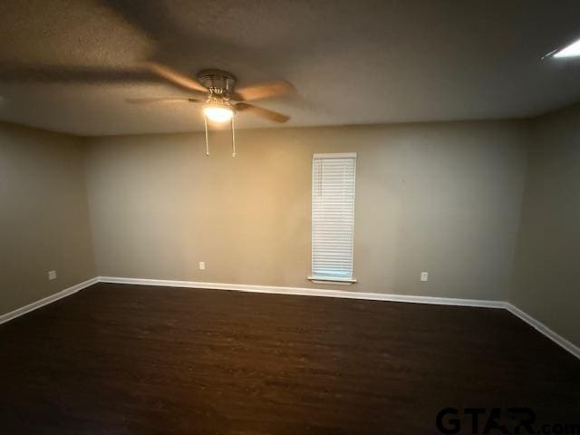 2523 Westminster Dr, Tyler, TX 75701 - empty room with dark wood-style floors and a ceiling fan