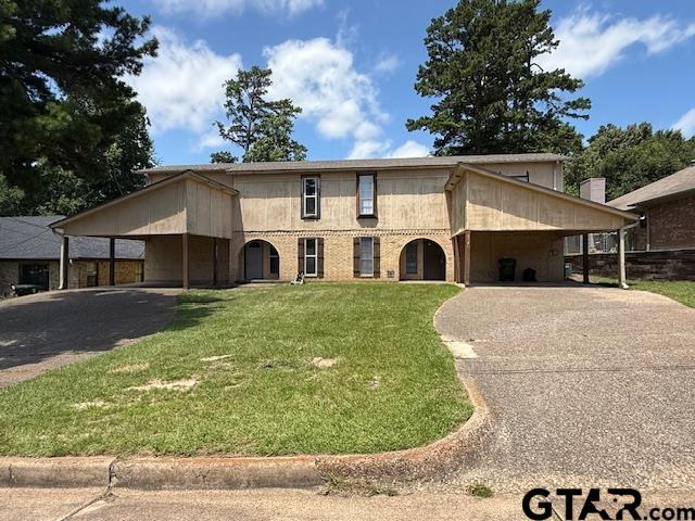 2523 Westminster Dr, Tyler, TX 75701 - view of front of house with driveway, a carport, and a front yard