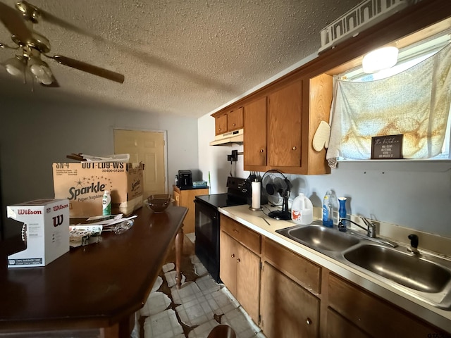 kitchen with sink, ceiling fan, a textured ceiling, and black range with electric cooktop