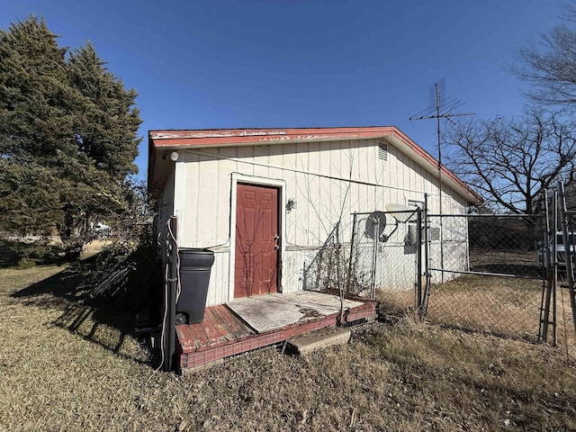 view of outbuilding with a lawn