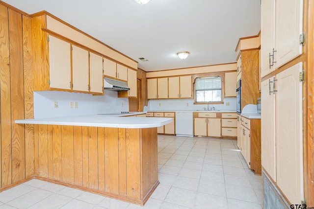 kitchen featuring dishwasher, sink, kitchen peninsula, oven, and light tile patterned floors